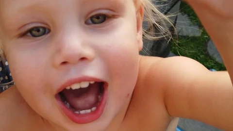 The white two-year-old laughs happily. Stock Footage 108132193