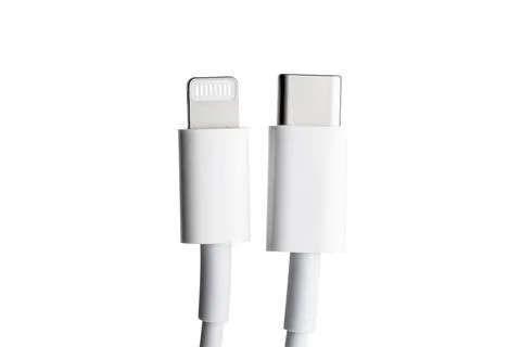 White Type-C cable and lightning, close-up on a white background Stock Photos