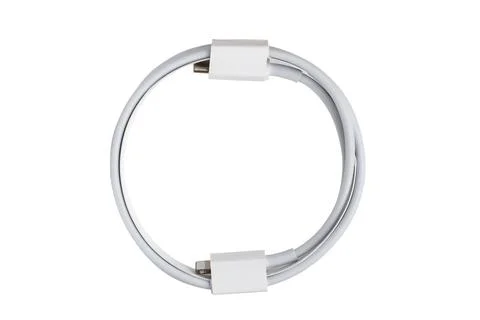 White type C charging cable and lightning, on a white isolated background, .. Stock Photos