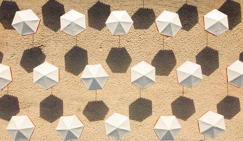 White umbrellas on the wall. Seamless pattern. Stock Photos