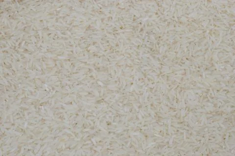 White uncooked rice background. shallow depth of field Stock Photos