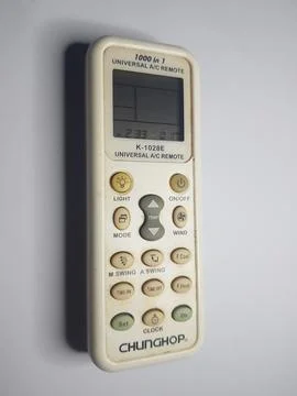 A white universal air conditioner remote from the top side view Stock Photos