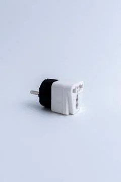 White universal electrical plug adapter isolated on a white background Stock Photos