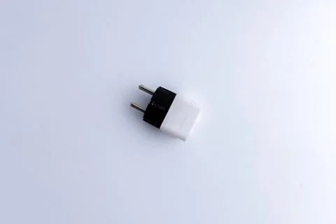 White universal electrical plug adapter isolated on a white background Stock Photos