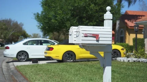 White US mailbox with a red flag in a suburban neighborhood - Florida Stock-Footage 91272097