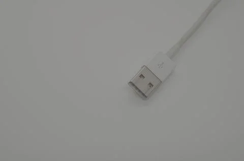 White USB cable on a grey background Stock Photos
