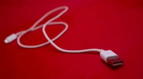 White USB cable in red background Stock Photos