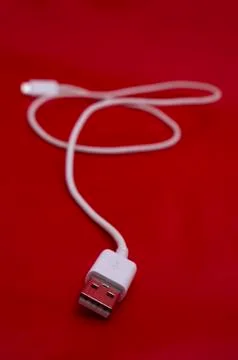 White USB cable in red background Stock Photos