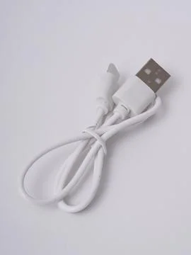 White usb charging cable coiled Stock Photos