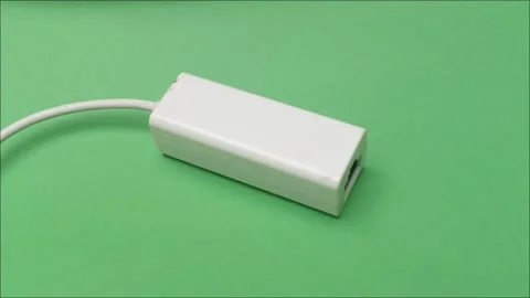 White USB to Ethernet Adapter on Green Screen Background Stock Footage 335191656