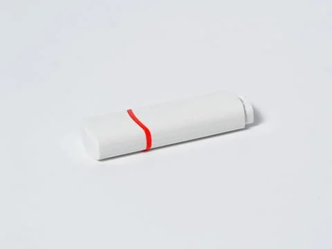 White usb flash drive isolated with a red stripe on the white background Stock Photos