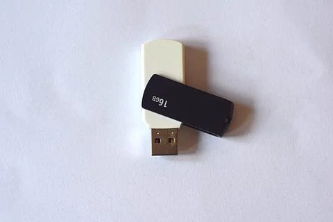 White USB flash drive on a light background Stock Photos