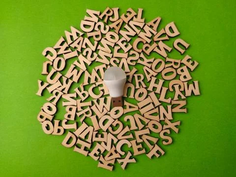 White USB LED light bulb placed on a vibrant green background. Positioned d.. Stock Photos