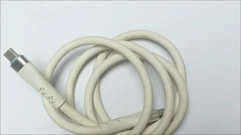 White USB Type-C Charging and Data Cable on Plain Background Stock Footage 334981921