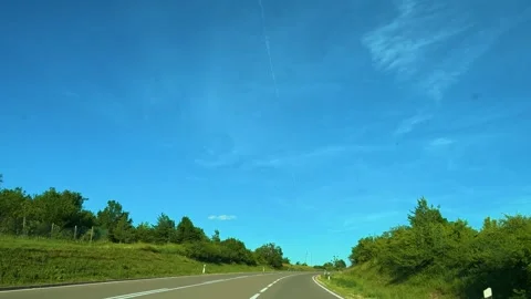 White van drives on open road under bright blue sky. Mount Rtanj Area, Serbia Stock Footage 340897994