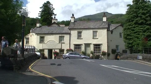 White Van Drives Through Coniston, Cumbria Stock Footage 990253