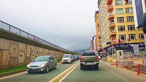 A white van driving down a street next to a building Stock Footage 273020164