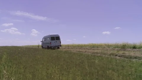 White Van stands in wheat field 스톡 동영상 78090064