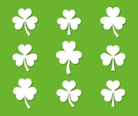 White vector clover leaves isolated on green Illustrazione stock