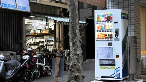 A white vending machine on the side of the store in Tokyo Japan Stock Footage 121584849