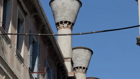 White ventilation chimneys and laundry on urban facade Stock Footage 335141611