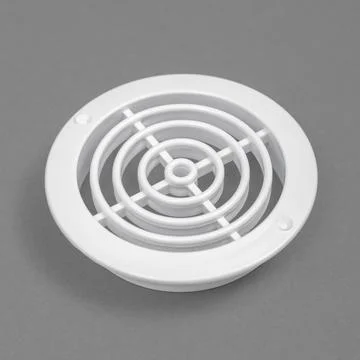 White ventilation grate on a gray background. Round shape. An element of th.. Stock Photos
