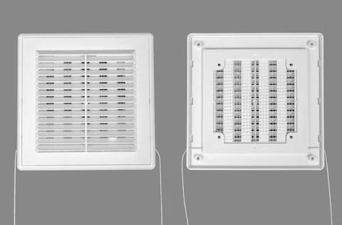 White ventilation grate on a gray background. Square shape, plastic material. Stock Photos