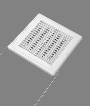 White ventilation grate on a gray background. Square shape, plastic material. Stock Photos