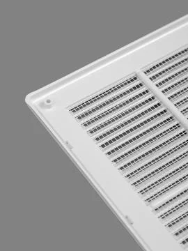 White ventilation grate on a gray background. Close-up. Material is plastic.. Stock Photos