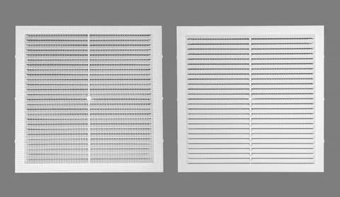 White ventilation grate on a gray background. Square shape, plastic materia.. Stock Photos