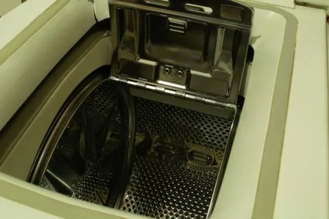 White vertical loading washing machine. Stock Photos