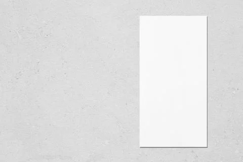 White vertical rectangle price-list or menu mockup on grey concrete backgroun Stock Photos
