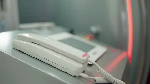 White video intercom handset on metal surface Stock Footage 342742338