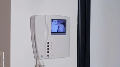 White Video Intercom that Turns on at the Ringing of the Doorbell Stock Footage 139328249