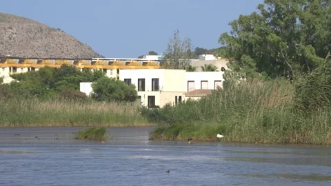 White Villa and Open Lagoon at Maristany Wetland, Mallorca, Spain Stock Footage 340589667
