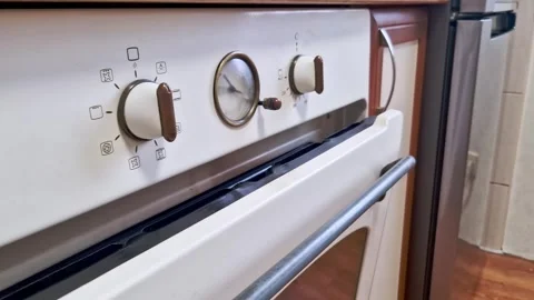 White Vintage Oven Control Panel with Brass Knobs Stock Footage 321962483