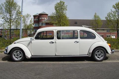 White Volkswagen stretched Beetle Limousine Stock Photos