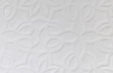 White wall background with various forms of ornamentation Stock Photos