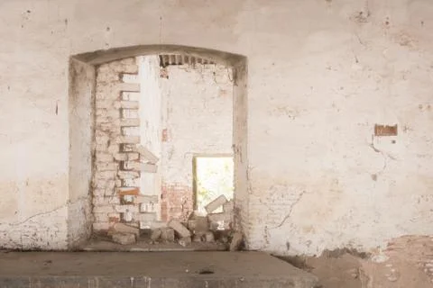White wall, brick door, window inbackground, platform, pedestal, old, abandon Stock Photos