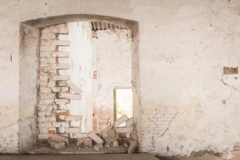 White wall, brick door, window inbackground, unfinished brick wall Stock Photos