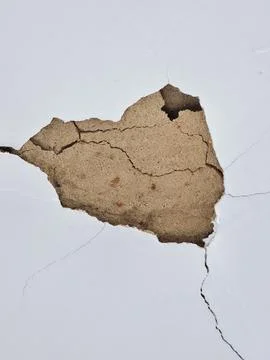 White wall with broken plaster Stock Photos