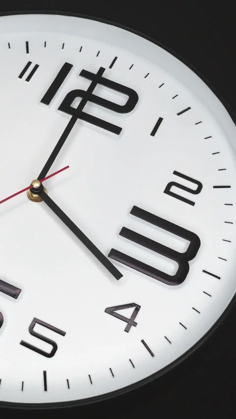 A White Wall Clock On Black Background With A Time Of 4.00 Am Or Pm. A Black Han Stock Footage 266740008