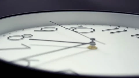 White wall clock, close-up, fast movement. Camera follows the second hand. Stock Footage 148741417