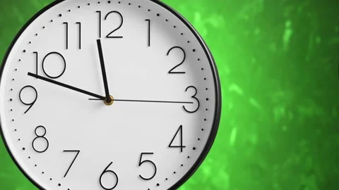 White wall clock on green background. Time concept. Stock Footage 150506894