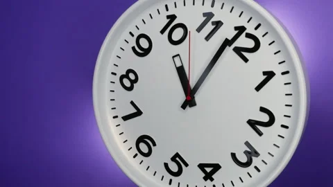 A White Wall Clock On Purple Background With A Time Of 10.00 Am Or Pm. A Black H Stock Footage 234624323