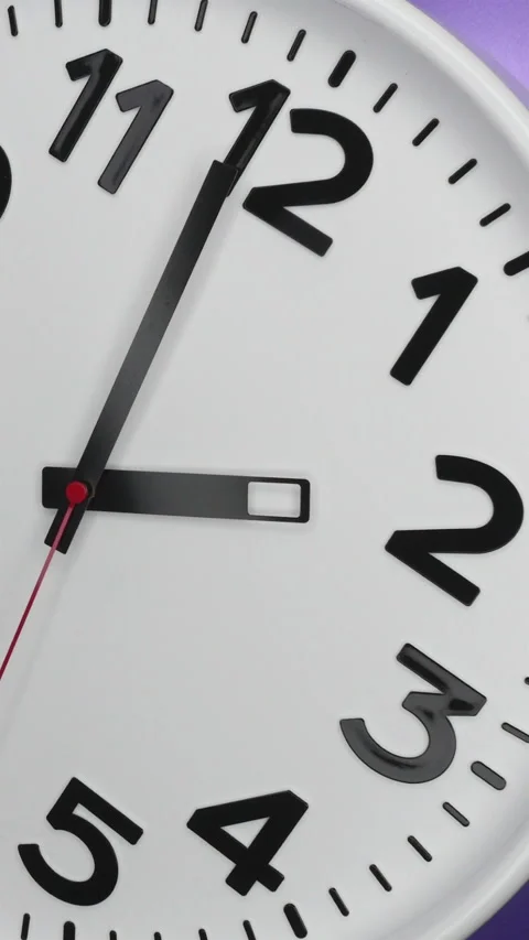 A White Wall Clock On Purple Background With A Time Of 2.00 Am Or Pm. A Black Ha Stock-Footage 266737782