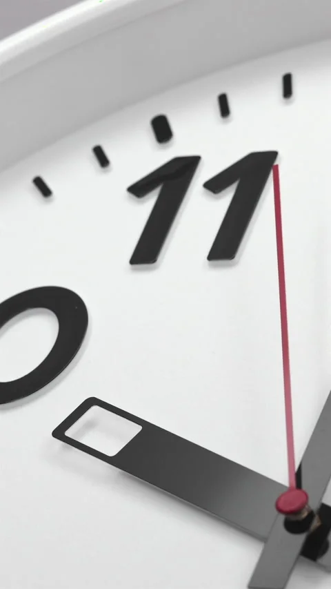 A White Wall Clock With The Time Of 10.00 Am Or Pm. A Black Hands and Red Second 스톡 동영상 266736503