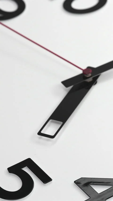 A White Wall Clock With The Time Of 5.00 Am Or Pm. A Black Hands and Red Second  Stock Footage 266734929