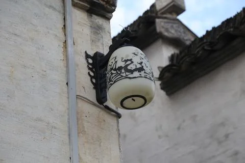 A white wall lamp with black patterns in the style of chinese art, hanging .. Stock Photos