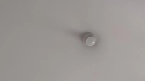 White Wall with Light Bulb Stock Photos